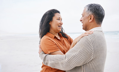 Image showing Beach, hug and senior happy couple love, support and care on travel holiday, retirement vacation and smile in outdoor nature. Eye contact, wellness and elderly man, old woman or marriage people bond