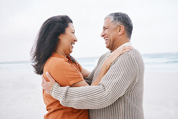 Image showing Hug, beach and elderly couple laugh at funny conversation, retirement joke or anniversary humour in Mexico. Tropical winter date, comedy and romantic man, mature woman or people bond, embrace or care