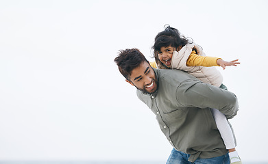 Image showing Outdoor, piggy back and father with girl, happy and energy with happiness, love and holiday with mockup space. Happy family, daughter and kid with parent, dad carrying child and support with vacation