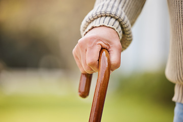 Image showing Walking stick, support and elderly with hands of person with a disability for injury, osteoporosis and medical. Healthcare, retirement and balance with closeup of old man and cane in nursing home