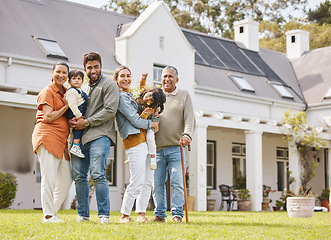 Image showing Happy big family, real estate and new home on grass or lawn together in happiness for property or investment. Portrait of parents, grandparents and kids hug for house, moving in or outdoor mortgage