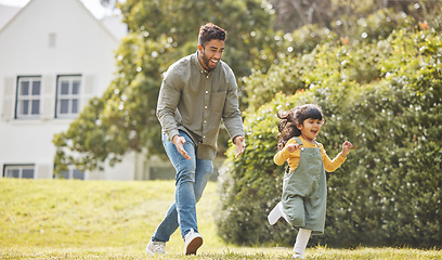 Image showing Happy, family running and garden of new home with love, support and fun with dad and kid. Backyard, smile and moving of game, father and young girl together with bonding outdoor and real estate