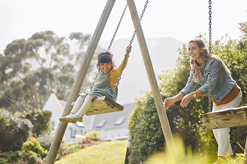 Image showing Happy, swing and mother and girl in park for playing, bonding and having fun together outdoors. Nature, weekend and mom push daughter in playground for relaxing, childhood and happiness in summer