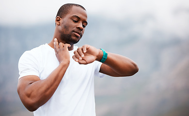 Image showing Fitness, watch and pulse with a black man hiking in the forest for health, wellness or cardio on space. Exercise, time and heart rate with a young athlete in the mountains or nature for running