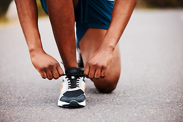 Image showing Shoes, hands and runner tie lace with fitness outdoor, road and marathon with start. Exercise, healthy and ready for race with run in street, athlete with sneakers and person training for sports