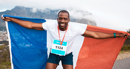 Image showing Runner man, flag and winner in portrait, pride and celebration for marathon, fitness and sports in street. Black guy, athlete and fabric for national sign, success or achievement at race in Cape Town