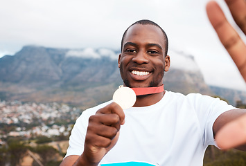 Image showing Runner man, medal and selfie for portrait at marathon, competition or celebration with smile in Cape Town. African winner guy, champion and memory for goal, contest or profile picture on social media