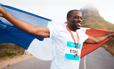 Image showing Winner celebration, flag and happy black man, runner and marathon victory of challenge, sports competition or race. Cardio, road and France athlete running with pride, success goals and gold medal