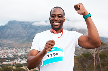 Image showing Runner man, celebration and medal in portrait for marathon, competition or race with smile in Cape Town. African winner guy, champion and goal in challenge, contest or fist for metal prize in nature