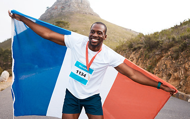 Image showing Runner man, flag and winner with smile, pride and celebration for marathon, fitness and sports for France. Black guy, athlete and fabric for national sign, success or achievement at race in Cape Town