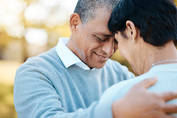 Image showing Happy, connection and senior couple hugging in a park on an outdoor date for romance, bonding or love. Smile, happiness and elderly man and woman in retirement in nature in field together at sunset.