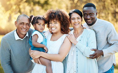 Image showing Smile, portrait and child with grandparents and parents in an outdoor park for adventure, holiday or weekend trip. Happy, excited and family generations bonding and having fun in nature in a field.