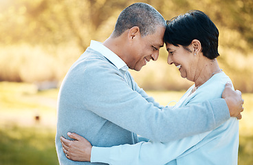 Image showing Mature couple, hug and love in garden for happy date, holiday and relax together in retirement. Man, woman and embrace with smile in park, nature and support of freedom, trust and loyalty to partner