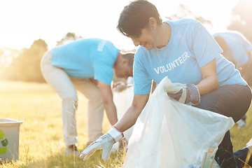 Image showing Nature recycling, community service volunteer and happy woman cleaning garbage, trash or pollution. Earth Day teamwork, eco friendly environment and charity team help with sustainable park clean up