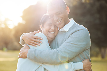 Image showing Nature, smile and senior couple hugging with love, care and romance on a date in outdoor park. Happy, laughing and elderly man and woman in retirement embracing, talking and bonding together in field