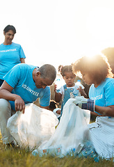 Image showing Nature activist, volunteering and family cleaning garbage pollution, trash litter or throw plastic bottle in recycle bag. Eco collaboration, waste management and community group help with planet care