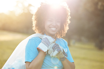 Image showing Nature portrait, community volunteer and happy woman cleaning garbage, eco waste and plastic trash. Sunshine, NGO service and activist support park clean up, outreach project or environment pollution