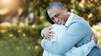 Image showing Love, nature and senior couple hugging in park for care, romance or comfort on an outdoor date. Smile, happy and elderly man and woman in retirement embracing for bonding in a green garden having fun