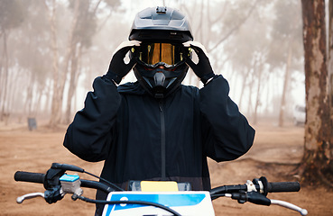 Image showing Motorbike, person and sport in forest with training for competition, ride in nature with action and helmet. Extreme, adrenaline and exercise, athlete and transport with dirt bike, freedom and travel