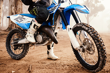 Image showing Motorcycle, person legs and sports in forest with training for competition, nature with action and helmet. Extreme, adrenaline and exercise, athlete and transport with dirt bike, freedom and travel