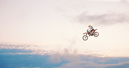 Image showing Motorcycle, sky background and competition for adventure, freedom and exercise with safety gear. Bike, jump and talent for training with fitness, balance or challenge in nature on mock up space