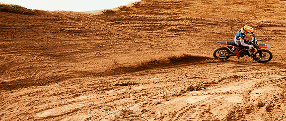 Image showing Bike, speed and a sports man on space in the desert for dirt biking from above. Motorcycle, fitness and power with a person driving fast on an off road course for training, freedom or performance