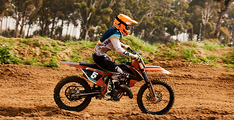 Image showing Motorcycle, training and speed with a sports man on space in the forest for dirt biking. Bike, fitness and power with a person driving fast on an off road course for freedom, challenge or performance