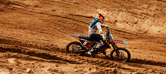 Image showing Motorcycle, freedom and speed with a sports man on space in the desert for dirt biking. Bike, fitness and power with a person driving fast on an off road course for a performance challenge on sand