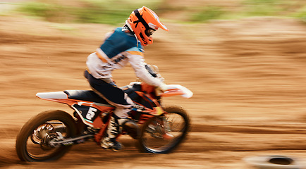 Image showing Motorcycle, sand and motion blur with a sports man on space in the desert for dirt biking. Bike, fitness and speed with a person driving on an off road course for freedom or performance closeup