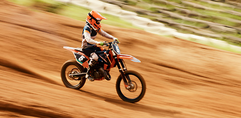 Image showing Bike, training and motion blur with a sports man on space in the desert for dirt biking. Motorcycle, fitness and power with a person driving at speed off road on sand for freedom or performance