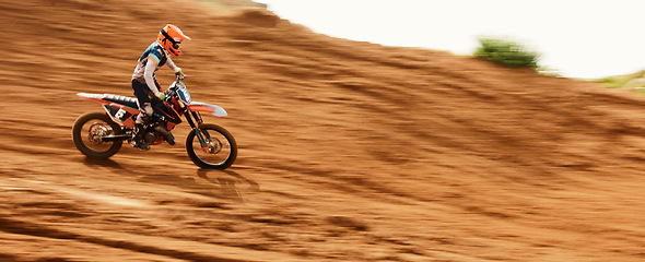 Image showing Motorcycle, freedom and motion blur with a sports man on space in the desert for dirt biking. Bike, fitness and power with a person driving fast on an off road course for challenge or performance