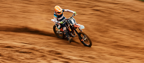 Image showing Bike, dust and motion blur with a sports man on space in the desert for dirt biking. Motorcycle, exercise and power with a person driving fast on sand or off road course for freedom or performance