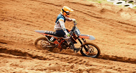 Image showing Motorcycle, dust and motion blur with a sports man on space in the desert for dirt biking. Bike, fitness and speed with a person driving on sand or off road course for freedom or performance