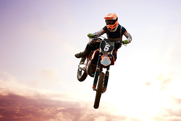 Image showing Motorcycle, person and jump for training or sports with fitness, balance or challenge in nature on mock up space. Bike, freedom and adventure for competition, exercise or talent with safety gear