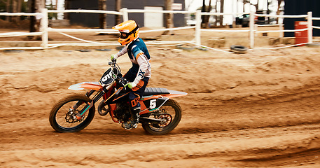 Image showing Motorcycle, fitness and motion blur with a sports man on space at an off road course for dirt biking. Bike, balance and power with a person driving fast during a race for freedom or performance