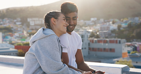 Image showing Happy couple, fitness and hug on rooftop break after workout, training or outdoor exercise together in city. Man and woman relax on balcony in rest from cardio, sports or practice in an urban town