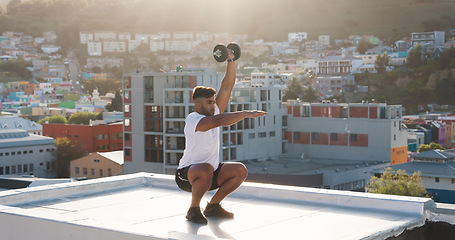 Image showing Man, fitness and squat with dumbbell on rooftop in workout, training or outdoor exercise in city. Active male person, athlete or bodybuilder lifting weights on balcony for healthy body or wellness