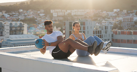 Image showing Health, medicine ball and fitness with couple in city for training, sports and support. Wellness, workout and exercise with man and woman on rooftop for challenge, teamwork and motivation together