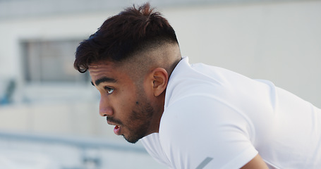 Image showing Tired man, fitness and break on rooftop after running exercise, cardio training or outdoor workout. Exhausted male person in rest or recovery from intense sports practice or body building activity