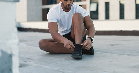 Image showing Fitness man, floor and tie shoes lace, sneakers and start exercise, training challenge or race workout, practice or activity. Running footwear, sportswear and urban runner prepare for sports cardio