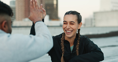 Image showing Happy couple, celebration or high five on rooftop for fitness exercise or workout together with pride or smile. Athletes, motivation or excited or man with woman, support or goal on building in city