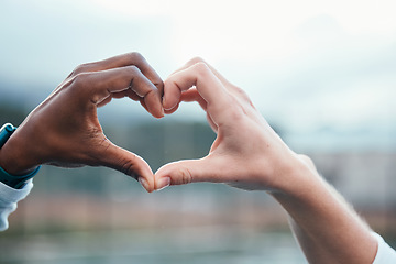 Image showing Outdoor, closeup and people with heart sign, hands and support with kindness, emoji and commitment. Outside, couple or interracial with symbol for love, trust and partnership with care, icon and like