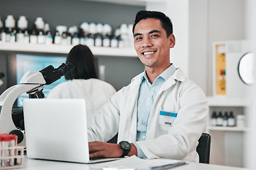 Image showing Science, man and portrait at laptop in laboratory for planning innovation, research and biotechnology software. Happy asian scientist working at computer to review data, investigation and development