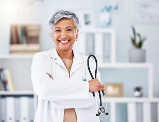 Image showing Doctor, senior woman and stethoscope, arms crossed for healthcare in hospital and professional cardiovascular surgeon. Portrait, health and medical tools with confidence, medicine and cardiology