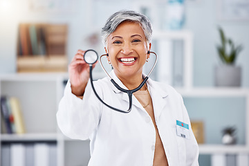 Image showing Doctor, woman and portrait with stethoscope for heartbeat, healthcare services or cardiology. Happy mature medical surgeon consulting with tools for listening, check breathing or test lungs in clinic