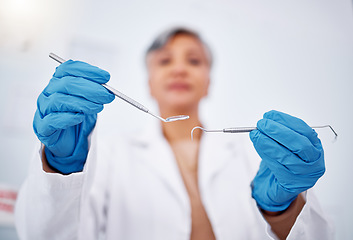 Image showing Dentist, hands and tools, healthcare and person at clinic for teeth cleaning, wellness and excavator for cavity. Dentist, metal equipment and health closeup, orthodontics and dental care with gloves