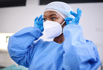 Image showing Scrubs, face mask and black woman, hospital surgeon or healthcare expert ready for surgery, clinic service or help. Nurse, scrubs and doctor commitment, job experience or prepare in operating theatre