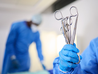 Image showing Hand, scissors and a doctor in a hospital or theatre to start operation with surgical tools. Zoom on a surgeon, assistant or staff with sterile equipment for medical procedure or emergency healthcare