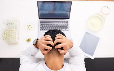 Image showing Man, scientist and laptop with headache in stress, anxiety or mistake and mental health in biology above at lab. Top view of male person, medical or healthcare research in burnout, depression or fail