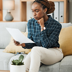 Image showing Planning, budget or black woman reading paperwork, bank document and investment report in home. Savings, insurance documents or African lady with loan information for financial future in living room